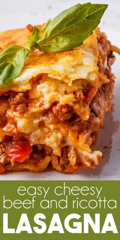 easy cheesy beef and ricotta lasagna with basil leaves on top