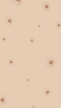 an orange and brown background with small sunbursts on the left hand side