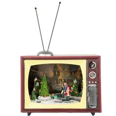 an old fashioned television with christmas decorations on the front and side, set against a white background