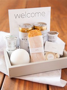 a welcome sign and some food in a box