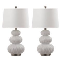 two white lamps sitting next to each other