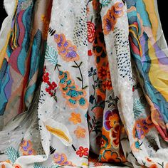 an assortment of different colored and patterned fabrics