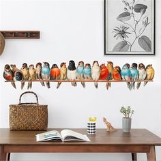 a group of birds sitting on top of a wooden shelf