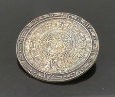 "MEXICO 925 Silver - Vintage Mayan Aztec Sun Calendar Round Brooch Pin - BP8417  Jewelry Type:         Brooch Pin   Metal Type:            925 Silver   Metal Size:             1.5\"  Stone Type:            N/A  Condition:              N/A  Jewelry Weight:     12.4 Grams  PLEASE NOTE: THIS ITEM IS PRE-OWNED. ALTHOUGH MOST ITEMS ARE IN VERY GOOD CONDITION, SOME MAY NEED CLEANING AND/OR MINOR REPAIRS. WE MAKE A VERY STRONG EFFORT TO UPLOAD CLEAR PICTURES. PLEASE INSPECT ALL PICTURES AND ASK ALL QUESTIONS YOU MAY HAVE PRIOR TO MAKING A PURCHASE. NOT ALL STONES ARE GENUINE, SOME ARE ENHANCED OR CREATED." Sun Calendar, Aztec Sun, Clear Pictures, Sterling Silver Charm, Silver Charms, Beautiful Rings, Types Of Metal, All Pictures, Brooch Pin