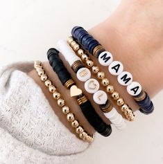 four different bracelets with the word mama written on them in gold, white and black