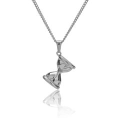 In the heart of this silver-toned hourglass pendant, the sands of time weave a delicate tapestry of moments, held within the enduring embrace of 316L stainless steel. Bathed in the gentle glow of silver, each grain of sand dances in eternal rhythm, whispering tales of fleeting hours and endless possibilities. The cool touch of metal, softened by the shimmering reflection of light, invites contemplation of life's transient beauty. As it adorns the wearer's neck, this pendant becomes more than a m Hourglass Jewelry, Sand Watch, Sand Dance, Hourglass Pendant, Time Turner, Sand Clock, Sand Glass, Sand Timer, Sand Timers