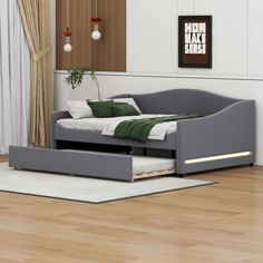 a bed sitting on top of a hard wood floor