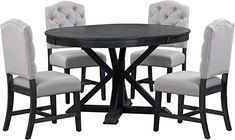 a round dining table with four chairs and an upholstered back side chair at the base