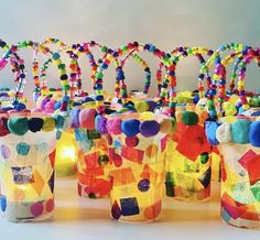 several jars filled with colorful beads and lights