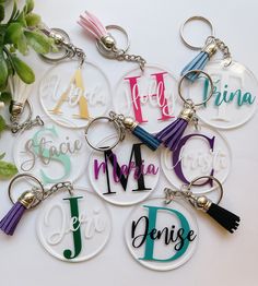 six personalized acrylic key chains with tassels