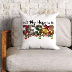 a pillow that says, all my hope is in jesus with christmas decorations on it