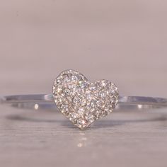 The Barley: Natural Diamond Pave Heart Ring In White Gold. This Exquisite Ring Features A Central Heart Pave Set With Round Brilliant-Cut Natural Diamonds, Totaling 0.10 Carats. The Polished Shank Enhances The Overall Elegance. Crafted In 14-Karat White Gold, The Ring Is Currently A Size 7.25 But Can Be Resized To Fit Any Finger For An Additional Fee Upon Request. Elegant Diamond White Heart Ring With Pave Setting, Heart Shaped Diamond Ring With Pave Setting, Diamond White Heart-shaped Pave Rings, Elegant Diamond-white Heart Ring With Pave Setting, Heart-shaped Diamond Jewelry With Pave Setting, Dimond Ring, Womens Jewelry Rings, Pave Diamonds, Natural Diamonds