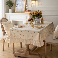 a dining room table with plates and cups on it