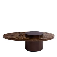 an oval wooden table with two circular bases on it's sides, and a brown base