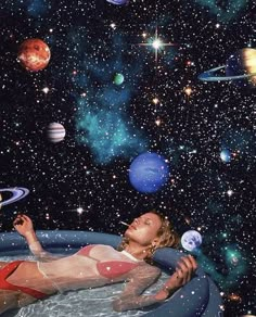 a woman floating in an inner space pool surrounded by planets and stars, with her eyes closed