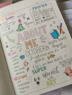 an open notebook with doodles and markers on it