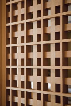 a close up of a wooden wall with squares and lines on the side, as if it were made out of plywood