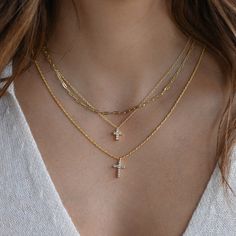 "Beautiful dainty cross necklace. It's beautiful and super high quality! It's perfect on its own or layered! Necklace on Model: Paperclip Necklace https://www.etsy.com/listing/937070408/small-paperclip-necklace-chain-necklace?click_key=1ad938bb6ed181fe3ebb1485e3b44cc732e86883%3A937070408&click_sum=ad2bdfd8&ga_search_query=paperclip%2Bnecklace&ref=shop_items_search_1&pro=1 Cross Necklace https://www.etsy.com/listing/1091255478/cross-necklace-cross-pendant-gold-cross?click_key=00d96cdd32910fa2ed67 Tiny Cross Necklace, Dainty Cross Necklace, Paperclip Necklace, Necklace Cross, Gold Cross Necklace, Gold Cross Pendant, Elegant Nails, Round Moissanite, Trombone