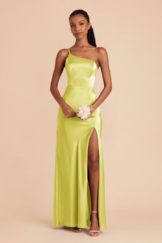 a woman in a lime green dress posing for the camera