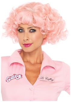 a woman with pink hair is posing for the camera wearing a pink shirt and wig