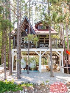 a house in the woods surrounded by trees