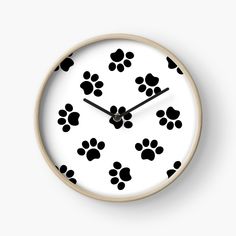 a clock with black paw prints on it