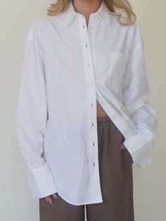 Made from the same GOTS certified organic cotton Oxford fabric as our Breezy Shirt, this is a longer version of a classic unisex shirt. This shirt has wide cuffs and a rounded hem at the front and back, making it perfect to wear casually over a pair of denim pants, or to dress up with suit pants. We also love wearing it thrown over our swim wear in the summer. Breezy Shirt, Djerf Avenue, Breezy Dress, Swim Wear, Wide Cuff, Suit Pants, Oxford Fabric, Sweaters And Jeans, Sweaters Knitwear