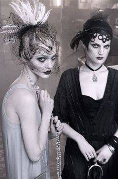 two women dressed up in costumes and makeup