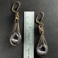 Elevate your style with our exquisite Tabasco Geode earrings, a striking blend of natural wonder and creative design by our wire wrap artist Lalańya! With their unique charm and vibrant energy, these earrings are not only a fashion statement but also a connection to the Earth's geological marvels. Geodes are known for their ability to harmonize energies and enhance spiritual connectivity. Wearing Tabasco Geodes can serve as a reminder of the Earth's magnificent creativity and resilience. The geode's crystalline interior symbolizes hidden treasures waiting to be discovered, mirroring the depths of human potential and inner beauty. These geodes are also excellent protective stones and they can be used to strengthen one's creativity! Wrapped by our exclusive artist, when properly cared for th Geode Earrings, Vibrant Energy, Inner Beauty, Hidden Treasures, Unique Charms, Wire Wrap, Natural Wonders, Wire Wrapping, Fashion Statement