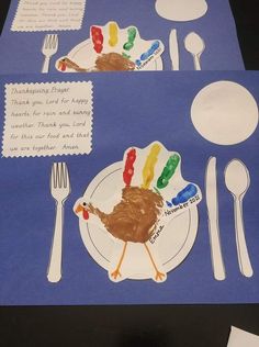 a paper plate with a turkey on it next to some forks and spoons in front of a blue table cloth