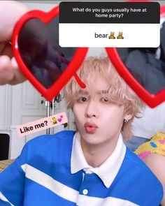 a person holding two heart shaped glasses in front of their face, with the caption'what do you guys usually have at least one? '