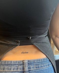 the back of a woman's stomach with her name written on it