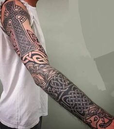 a man with a tattoo on his arm