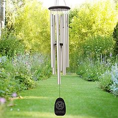 a wind chime in the middle of a garden