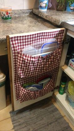 an open refrigerator door in a kitchen