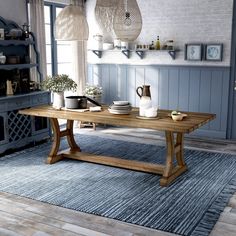 a wooden table sitting on top of a blue rug