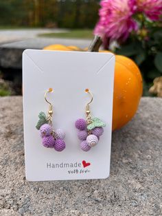 These charming Crochet Grape Earrings are a perfect festive accessory or thoughtful gift for her! Expertly handcrafted using intricate microcrochet techniques, these dangle earrings feature delicate donut designs that add a playful, unique touch. Each pair is crafted with love and care, using high-quality materials and finished with 14k gold-plated hooks for a touch of elegance. Lightweight and comfortable to wear, they make a standout piece of handmade jewelry that's perfect for the holiday season or year-round fun. Whether you're treating yourself or surprising a loved one, these kiwi earrings are a whimsical, stylish addition to any collection! Features: Handmade with love using microcrochet techniques 14k gold-plated hooks for a luxurious touch Lightweight and comfortable for extended Kiwi Earrings, Grape Earrings, Crochet Unique, Thoughtful Gifts For Her, Unique Holiday Gifts, Raisin, Handmade Earrings, Crochet Earrings, Favorite Jewelry