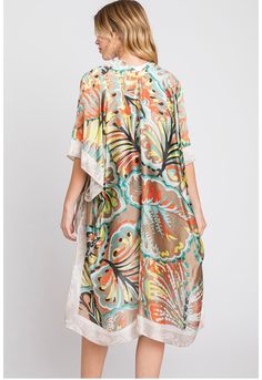 Indulge in the essence of summer with our feminine Floral Summer Kimono, where style meets comfort in the most enchanting way. Designed for versatility, this kimono transitions seamlessly from casual outings to special occasional. Pair with denim shorts and a tank top for a laid-back daytime look, or layer it over a sundress for a whimsical evening ensemble. About me One size fits most Fabric: 100% Polyester Size 35X36 Care for me Hand wash cold Do not bleach Low iron if needed Do not tumble dry *Due to the many variations in monitors, the color in the image could look slightly different.* Spring Multicolor Beach Kimono, Chic Multicolor Kimono For Spring, Casual Short Sleeve Kimono For Day Out, Spring Beach Multicolor Kimono, Spring Beachwear Flowy Kimono, Spring Beach Kimono With Kimono Sleeves, Multicolor Kimono For Summer, Multicolor Kimono With Kimono Sleeves For Summer, Printed Summer Cover-up