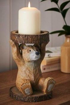 a candle holder with a bear on it