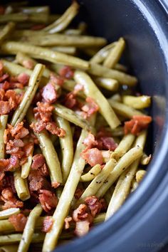 green beans with bacon in a crockpot ready to be cooked for dinner or lunch