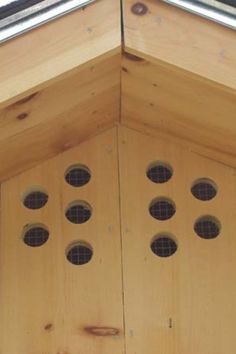 a bird house with six holes in the roof