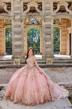 The fabric in this Princesa by Ariana Vara Quinceanera dress is Cracked Ice, Iridescent Sequin Tulle, Tulle, Stone Accents, Three-Dimensional Flowers, Pongee Lining. Detachable Off-the-Shoulder Drape, Cape, Detachable Train, Separate Full Bodice Liner, Earrings Included Rose Gold Quince Dress, Gold Quince Dress, Rose Gold Quinceanera Dresses, Rose Gold Quinceanera, Quinceanera Dresses Gold, Pink Quince, Rapunzel Dress, Sweet 15 Dresses, Quinceanera Dresses Pink