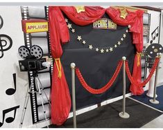 the stage is decorated with red curtains and gold stars