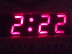 a digital clock displaying the time in red