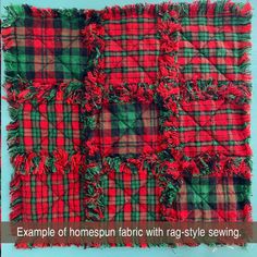 a red and green plaid fabric with fringes on the edges is displayed in front of a blue background