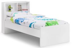 a white bed with a book shelf headboard