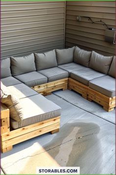 a couch made out of wooden pallets sitting on top of a patio