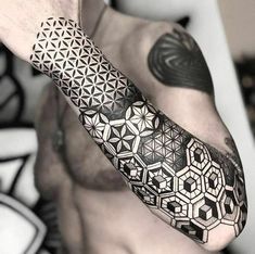 a man's arm with geometric designs on it