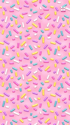 colorful sprinkles on a pink background