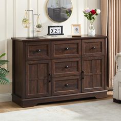 a wooden cabinet with drawers in a living room